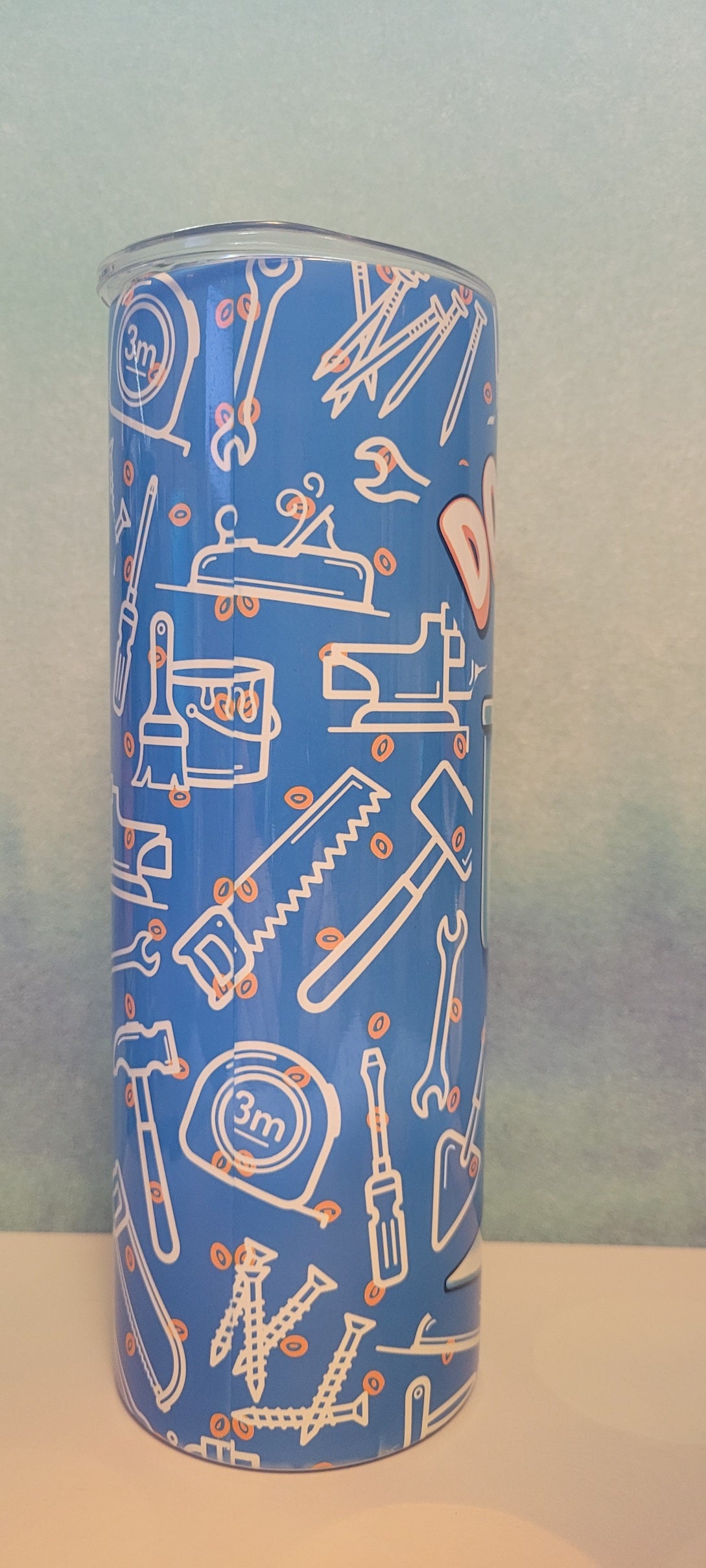Doing Dad Shit. Just as it says. A Dad skeleton sitting on the throne will catching up on social media. A blue background with various tools a dad uses all the time fully wraps