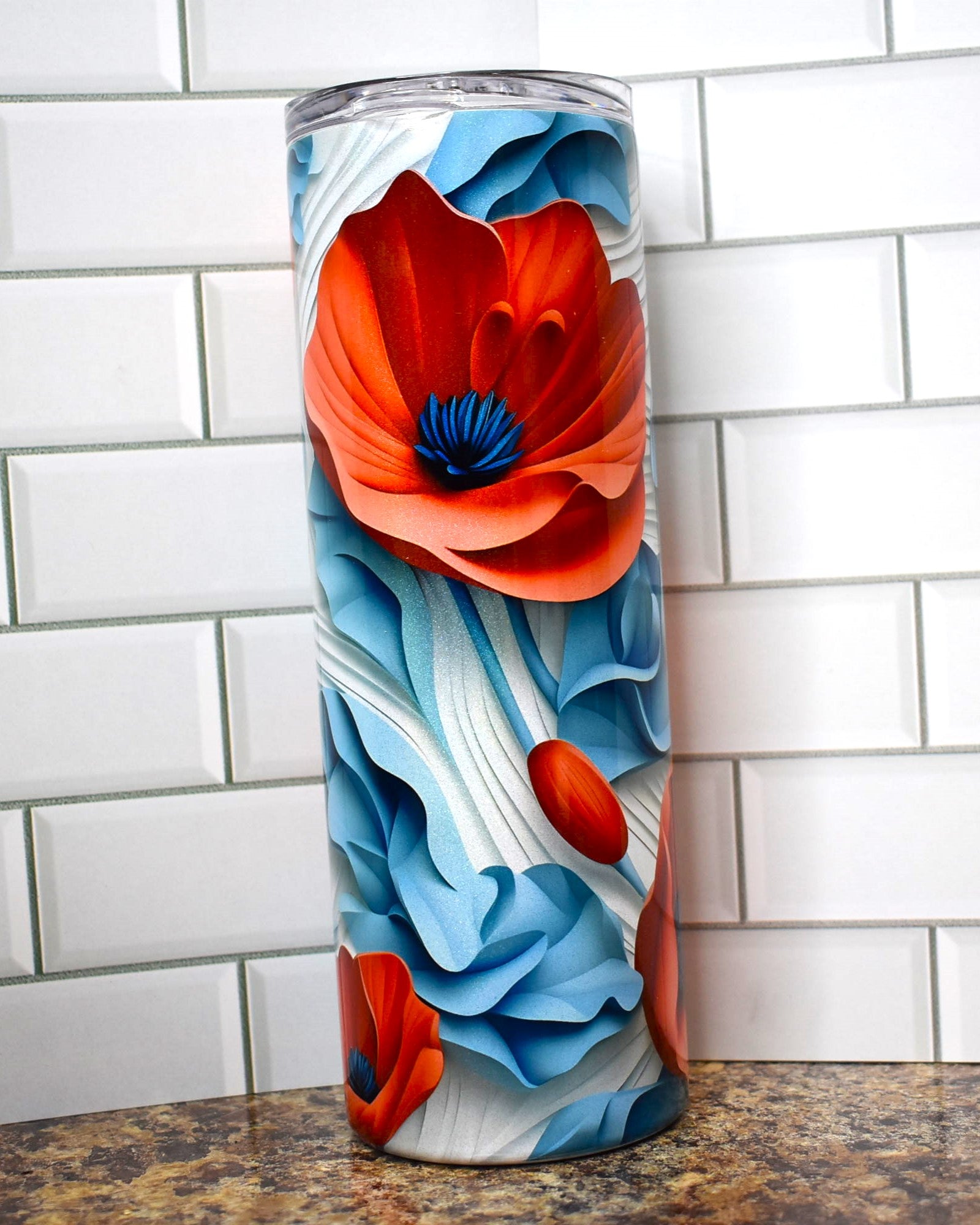 Red Poppies on a white and blue background in 3D are popping all over this tumbler. This Makerflo 20 oz tumbler is made of high-quality stainless steel construction and sweat-resistant design ensures your favorite drinks stay cool for longer. 