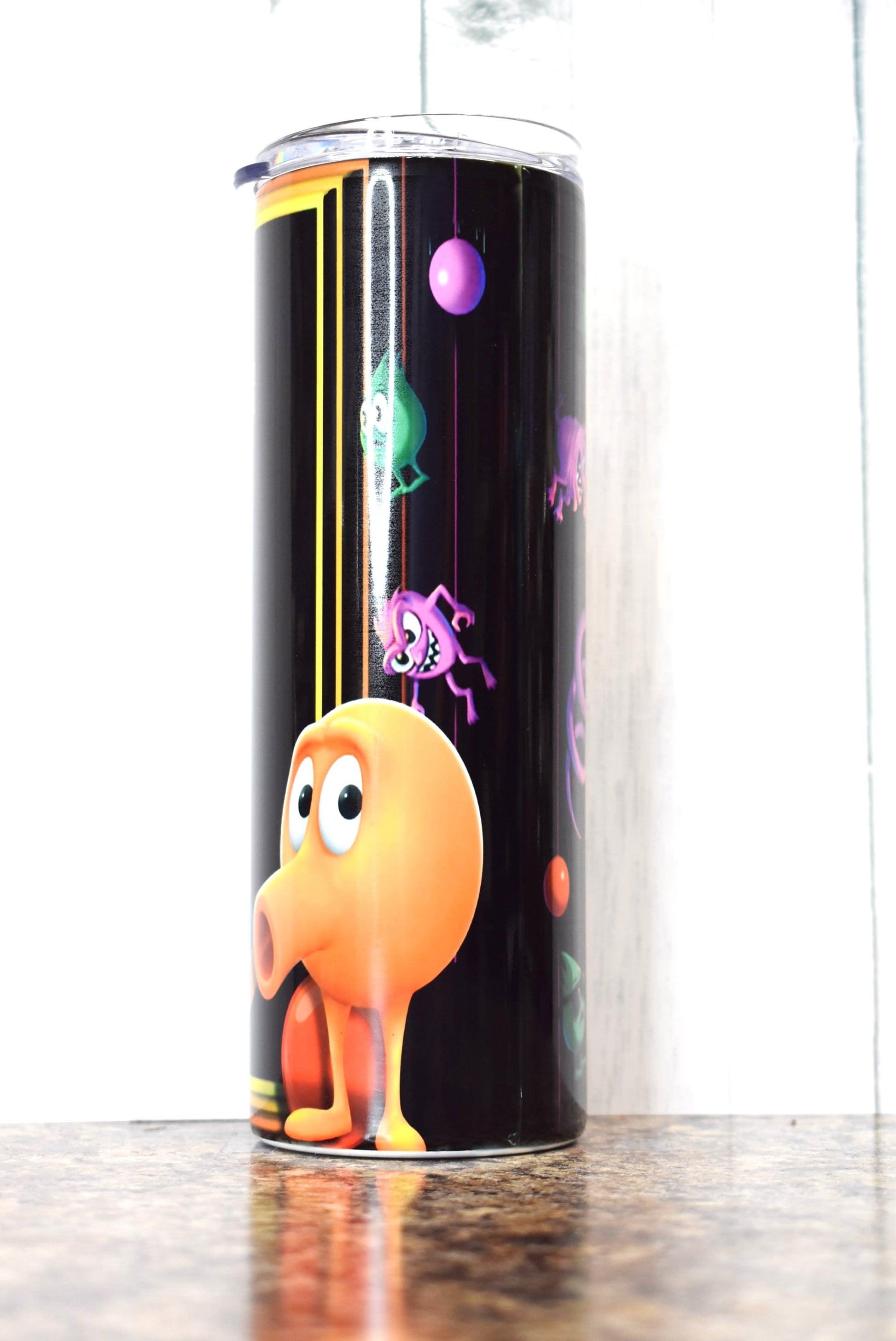 Take a stroll back to 1982 and plug those quarters into that create arcade classic Q-Bert. This is a 20 oz Makerflo Stainless Steel Tumbler.