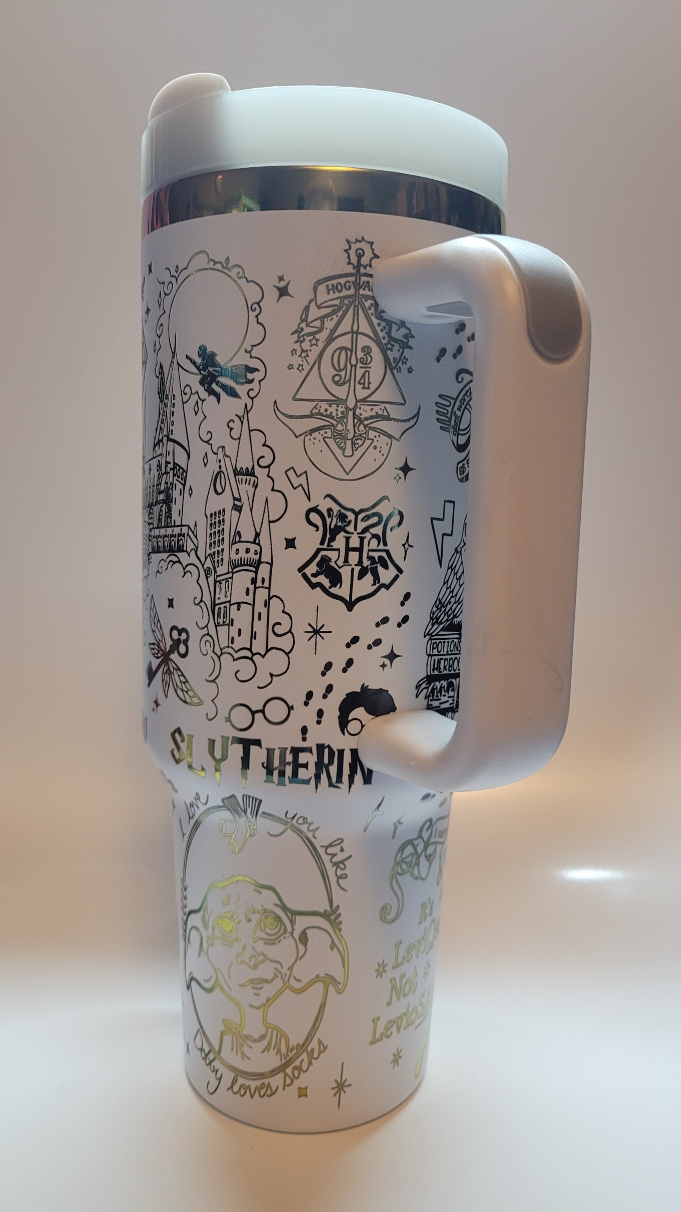 White tumbler with black graphics and text on a white background