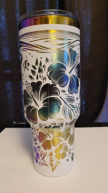 Introducing the latest addition to our collection: the 40 oz Gold Plated Tumbler featuring laser-etched full-wrap from another on a sleek white background. 3 sea turtles swimming around other sea life