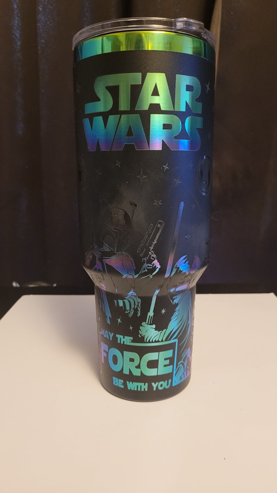 Tumbler with Star Wars design featuring a character and text on a dark background