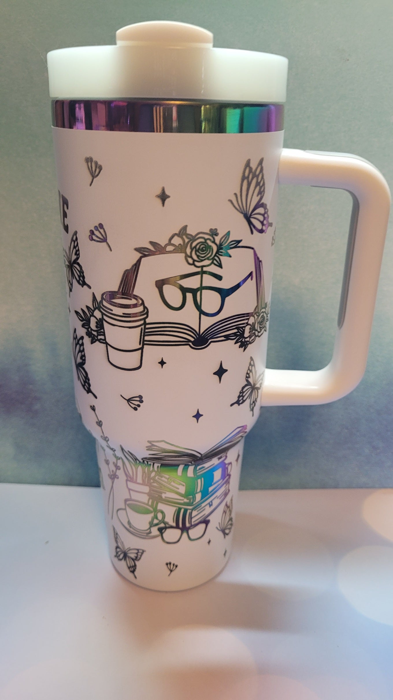 White mug with colorful designs on a white background