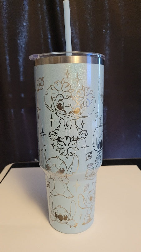 Tumbler with cartoon character design on a white surface with a dark background