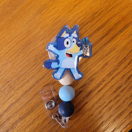 Another new one to our Animal Series... Iced Coffee Heeler. This badge reel features a blue heeler in mid jump while holding an iced coffee.
