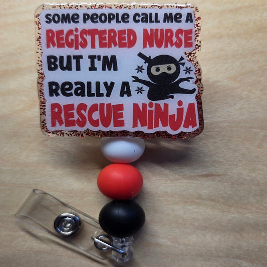 Badge holder with humorous design of a 'Rescue Ninja' on a wooden surface