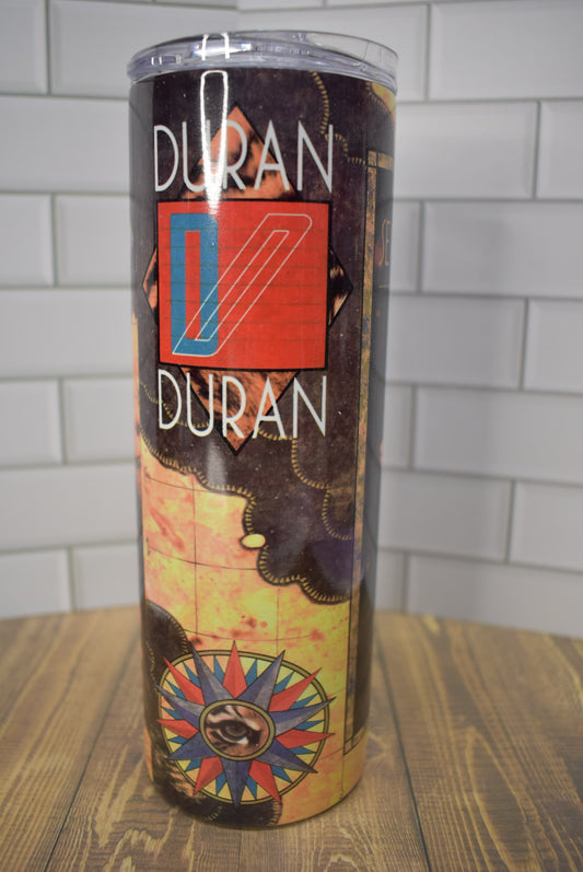 Take a Trip back to the 80's with this Duran Duran Classic Seven And The Ragged Tiger 20 oz Stainless Steel tumbler.    Stainless Steel Double-Wall    Vacuum Insulated   Clear Sliding Classic Lid    Clear Straw   BPA FREE   Stays Cold 24+ hours & Warm 8 hours