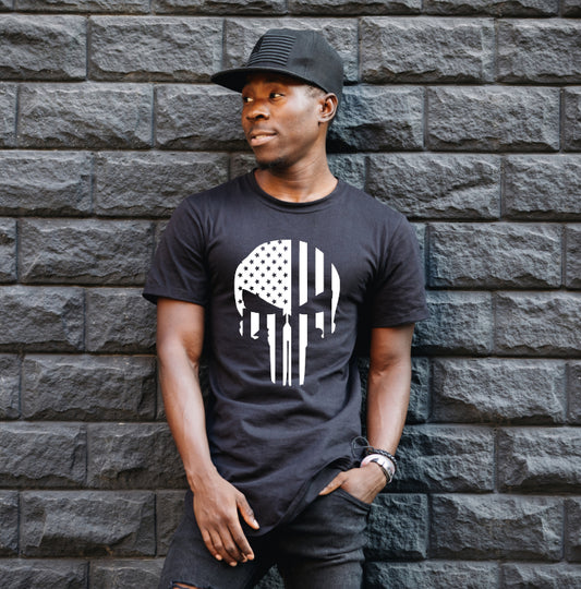This Punisher T-Shirt boasts a Stars & Stripes pattern with a white screen print transfer. It's designed for adult unisex sizes with a fabric weight of 5.3 oz. and 100% preshrunk cotton.